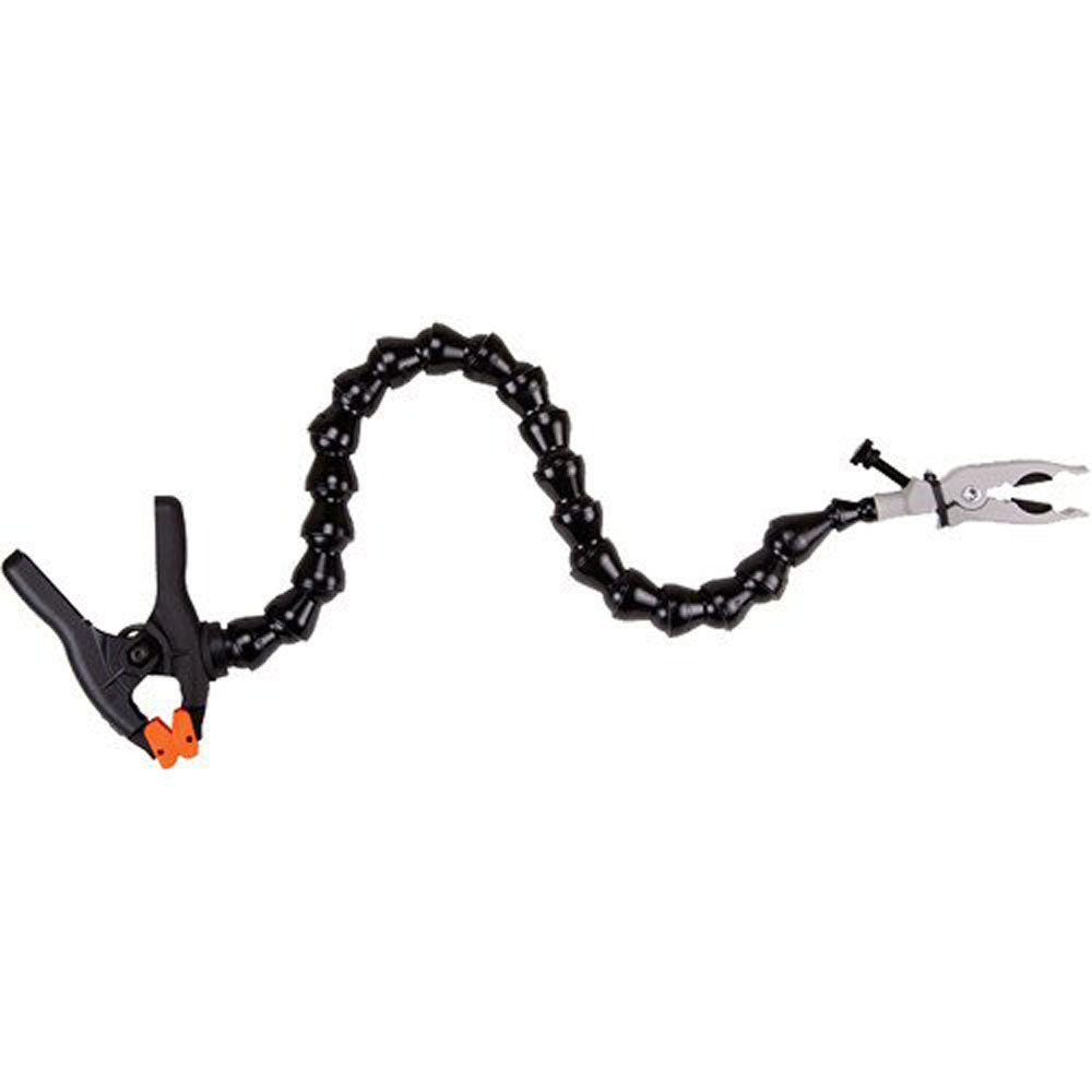 Wimberley The Plamp II articulated Loc-Line arm clamp attached to a tripod leg, holding a small object with foam-padded jaws for precise positioning in photography.