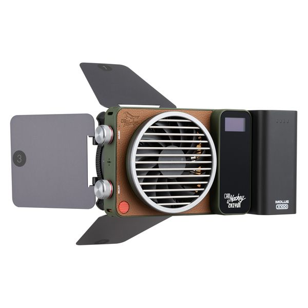 Zhiyun X100 RGB compact handheld video light with mini lens reflector and magnetic barn doors for even, vibrant lighting.