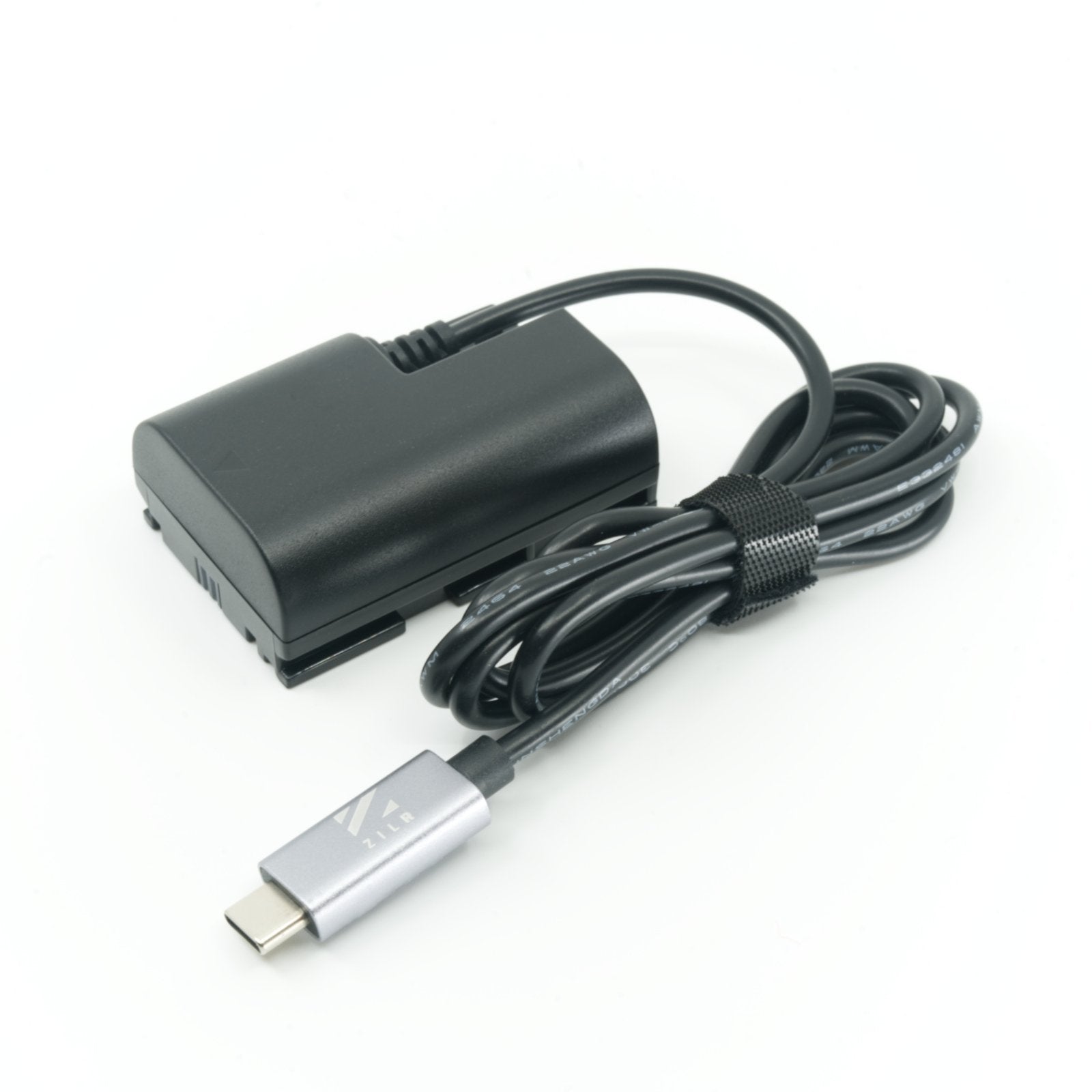 ZILR Dummy Battery LP‑E6 with built-in USB‑C cable for Canon cameras, shown as a rectangular power adapter replica that fits into the camera’s battery compartment and provides continuous power via USB‑C connection.