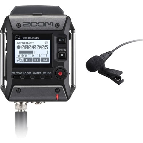 Zoom F1 field recorder kit with lavalier microphone: recorder unit with display and buttons, clip-on lavalier mic with screw-lock plug, windscreen, belt clip, and AAA batteries, all shown against a plain neutral background.
