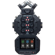 Zoom H8 portable handy recorder showing its color touchscreen, X/Y mic capsule, multiple input gain knobs, outputs and buttons, viewed at slight angle against a neutral background.